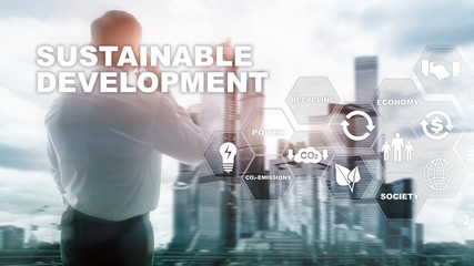 Sustainable development, ecology and environment protection concept. Renewable energy and natural resources. Double exposure of success businessman with abstract building