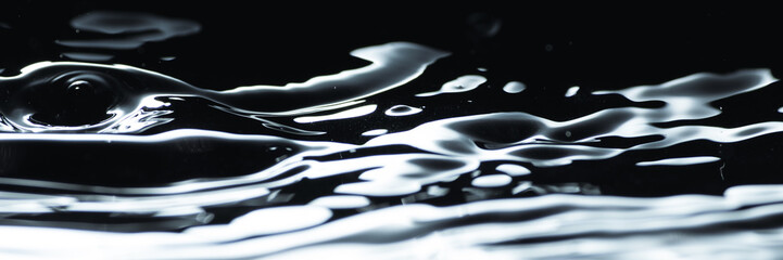 Poster - Water droplet splash backgound texture isolated on black. Fresh clean pure water ripples and splashes.  