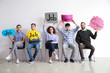 © Pixel-Shot - Young people holding speech bubbles with words JOB and CAREER indoors