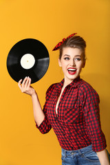 Poster - Beautiful pin-up woman with vinyl disc on color background