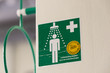 green sign for a laboratory safety and emergency shower