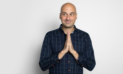 Wall Mural - Happy bald guy looking away isolated