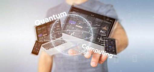 Poster - Businessman holding Quantum computing concept with qubit and devices 3d rendering