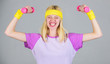 © be free - Workout result. Woman fitness coach exercising with dumbbell. Easy biceps exercise. Workout with dumbbell. Workout sport and dieting. Weight loss concept. Woman workout in gym with sport equipment