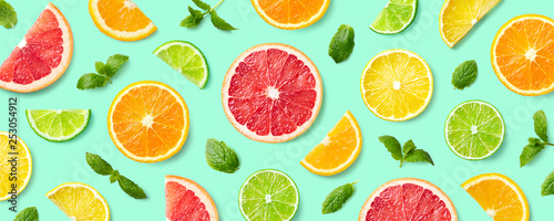 Fotomural Colorful pattern of citrus fruit slices and mint leaves