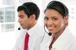 © potstock - Customer service representatives at work in call center - multi ethnic team - pretty young woman - portrait