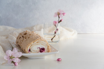 Wall Mural - Spring meringue cake roll with cream cheese and berry filling