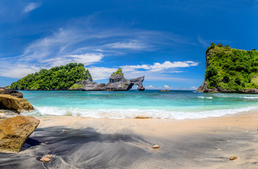 View of idyllic tropical beach with small island and perfect azure clean water