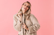 © Drobot Dean - Pretty woman posing isolated over pink wall background wearing accessories and jewelry.