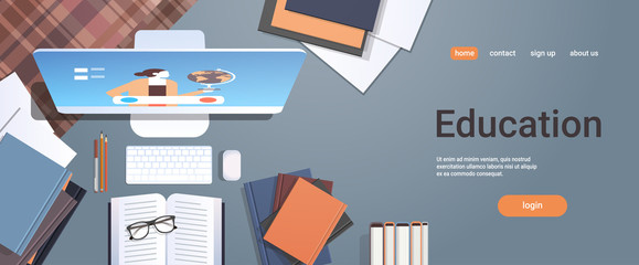 Poster - university student workplace e-learning online education concept top angle view desktop with books and computer monitor office stuff horizontal copy space