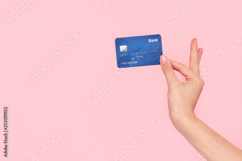 Cuadros en Lienzo Coquette girl holding bank card