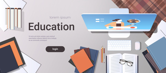 Poster - university student workplace e-learning online education concept top angle view desktop with books and computer monitor office stuff horizontal copy space