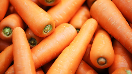 Wall Mural - Beautiful ripe carrot background.Carrots in the supermarket.