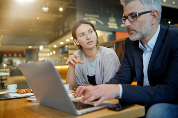 Wall Mural - Informal meeting between salesman and manager in modern work space