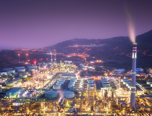 Wall Mural - industrial factory with smokestacks and smoke at night