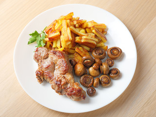 Wall Mural - steak with fried potatoes and mushrooms