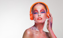 Bright Beautiful Woman DJ In Orange Headphones