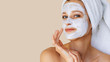 © Olesia - Beautiful young woman with facial mask on her face. Skin care and treatment, spa, natural beauty and cosmetology concept.