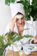 © lordn - Young woman applying face mask at home. Natural Skin Care Routine For Glowing Skin.