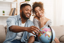 African-american Couple With Globe Choosing Place For Travel