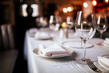 A Close Up Shot Of A Restaurant Table Set Up With Tableware And Wine Glass. Concept Of Dining, Hospitality And Catering. Horizontal Image With Free Space For Text.
