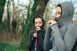 © GAGO IMAGES - Two young beautiful woman exercise in the forest