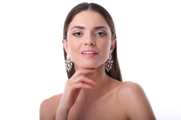 Young, elegant woman with glamour make up and rich earrings.