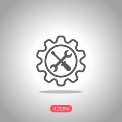 Wrench and screwdriver in gear. Icon under spotlight. Gray background