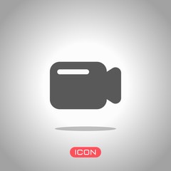 Poster - simple video camera icon. icon under spotlight. gray background