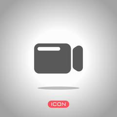 Poster - simple video camera icon. icon under spotlight. gray background