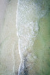 Waves crashing on beach drone aerial