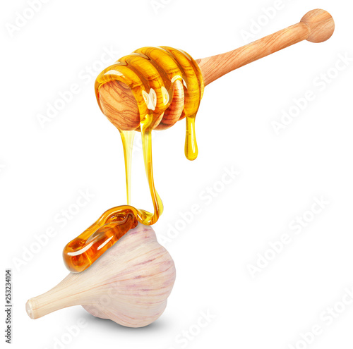 Photographie honey dripping on garlic isolated on white