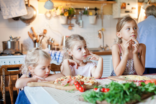 Children Are Waiting For Dinner Three Hungry Kids Sitting At Children Are Waiting For Dinner Three Hungry Kids Sitting At Family Table With Hot
