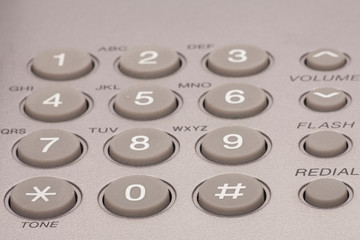 Close up shot of grey phone keypad