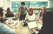 © .shock - multiethnic business team learning about drone technology