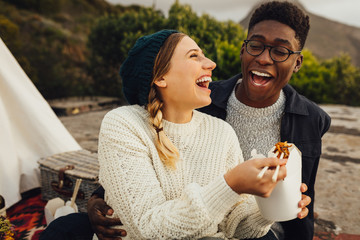 Wall Mural - couple enjoying outdoors on picnic
