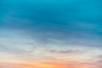 Wall Mural - sunset sky with violet yellow light clouds. colorful smooth blue sky gradient. natural background of