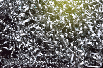 A lot of metal shavings after working on a milling machine or CNC machine. Metal shavings texture