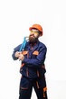 © Svitlana - Bearded man with repair tools in hand. Repair service. Worker in helmet with pipe wrench. Bearded man in construction helmet. Uniform. Mechanic. Plumbing and renovation. Pipe wrench.