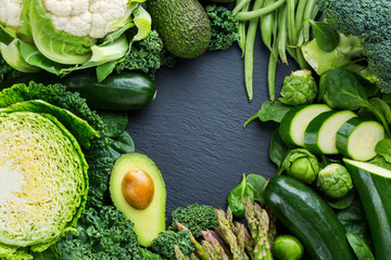 Wall Mural - Assortment of organic green vegetables, clean eating vegan concept