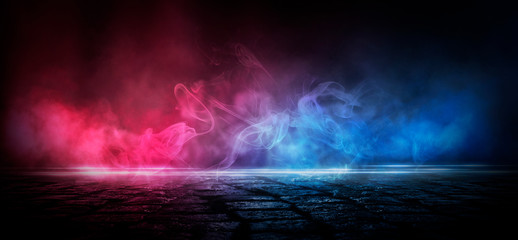 Wet asphalt, reflection of neon lights, a searchlight, smoke. Abstract light in a dark empty street with smoke, smog. Dark background scene of empty street, night view, night city.