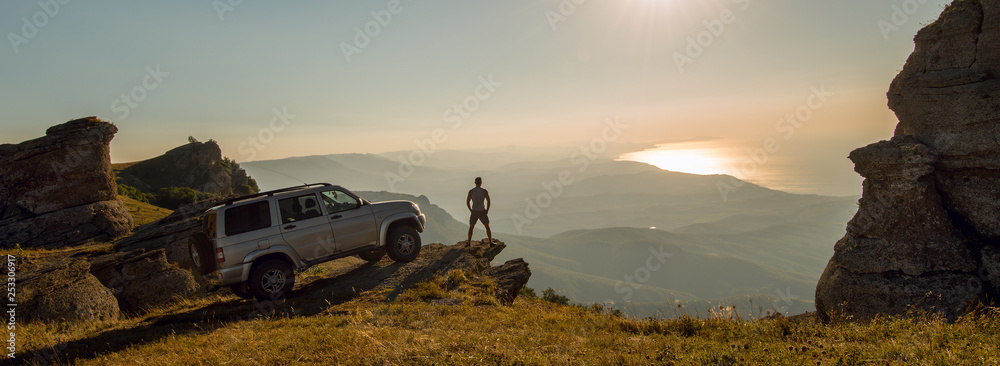 man with car on beauty nature landscape background - obrazy, fototapety, plakaty 