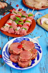 Wall Mural - raw pork medallions and turkey meat skewers