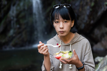 Wall Mural - Asian woman eat salad