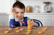 © Lisa Tichané - Little boy making a stack of cookie