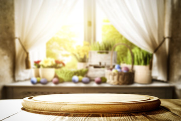 Wall Mural - Wooden table of free space for your decoration. Spring window background. Easter eggs and flowers on window sill. 