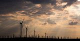 Fototapeta Londyn - Wind turbines on the background of a beautiful sky