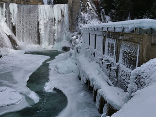  old hydro dam in the winter with waterfalls