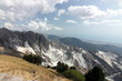 Panorama of the white marble quarries of Carrara on the Apuan Alps. The white parts of the mountain highlight the areas of stone extraction.