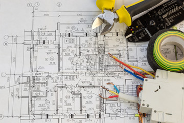 still life of electrical components arranged on plans